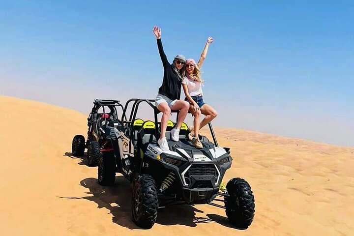 Experience the exhilarating freedom of the Red Desert while driving powerful Dune Buggies and Quad Bikes surrounded by stunning sand dunes and endless blue skies. Adventure awaits!